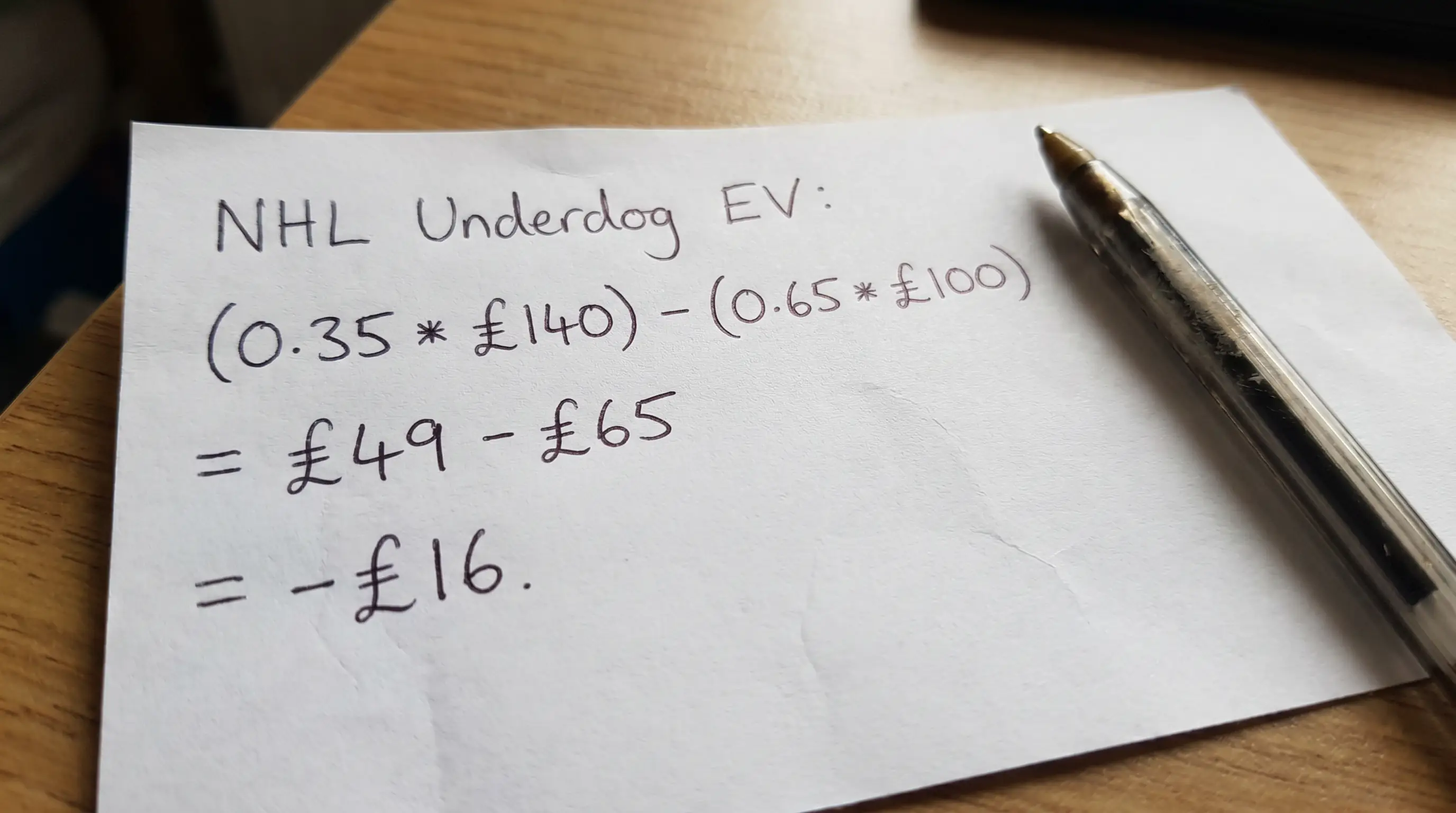 Clean handwritten expected value calculation for an NHL underdog bet with GBP figures