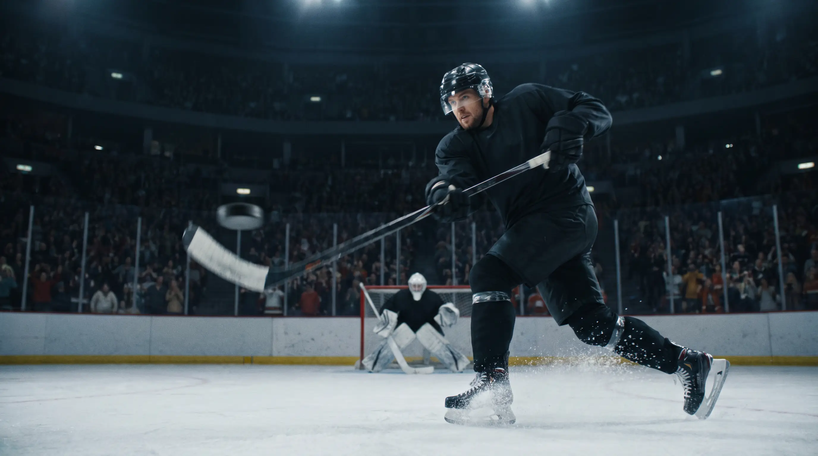 Ice hockey forward taking a powerful shot on goal during game action