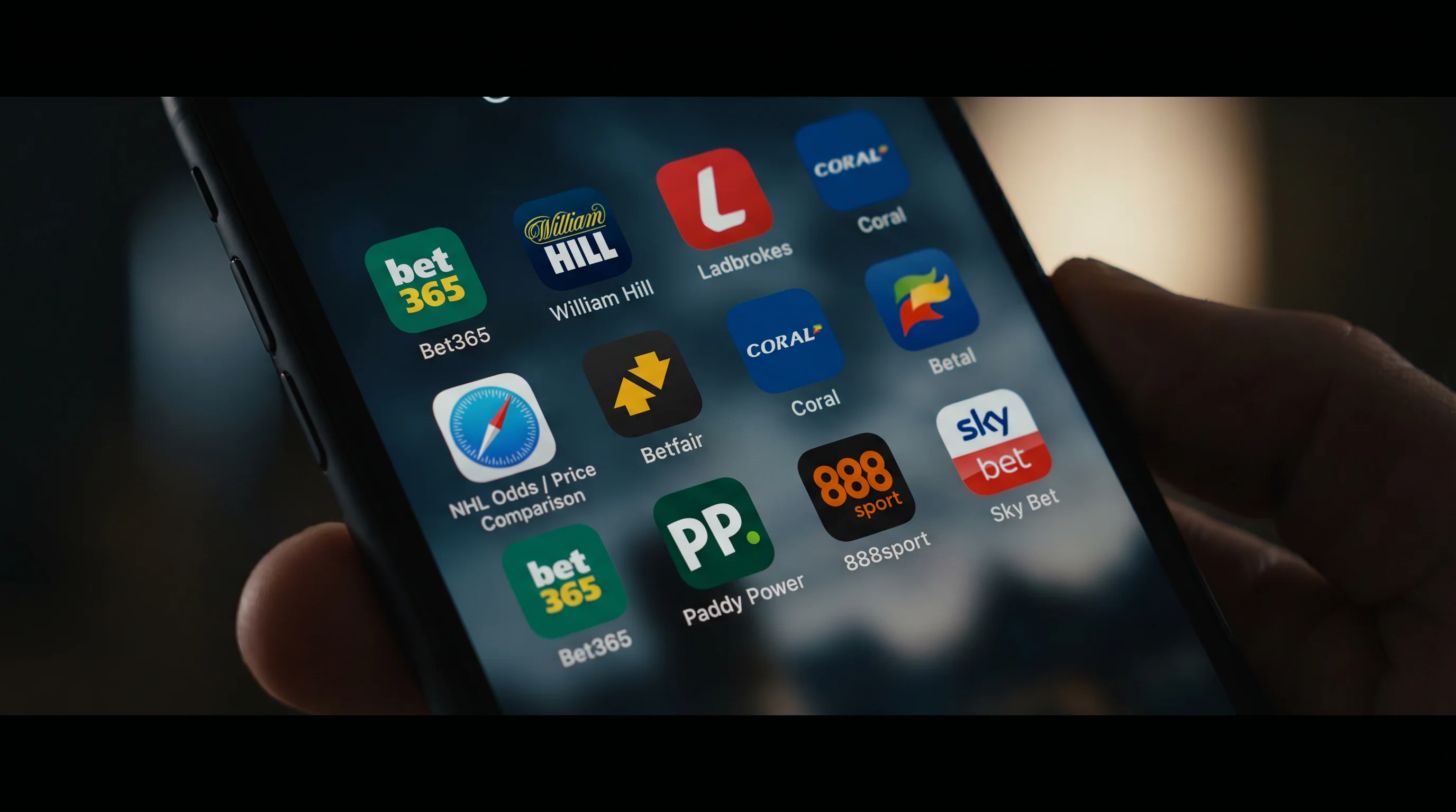 Phone screen showing multiple UK bookmaker apps side by side for price comparison